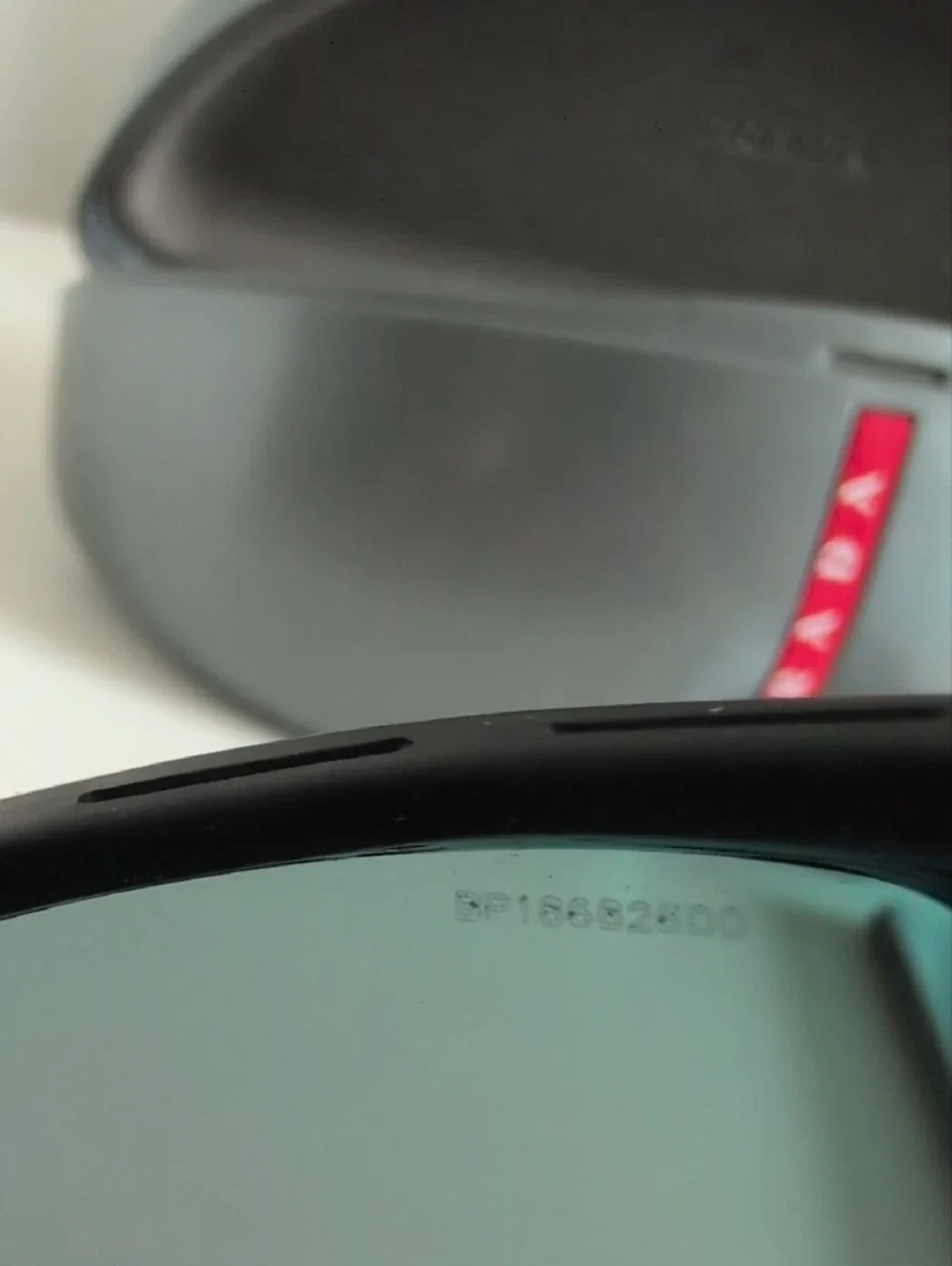 Prada Black Sunglasses with Red-Orange Mirrored Lenses
